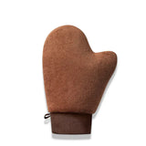 Gant de lotion autobronzant en tissu marron avec une sangle.