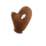 Gant brun pour application de lotion autobronzante avec une touche de crème.