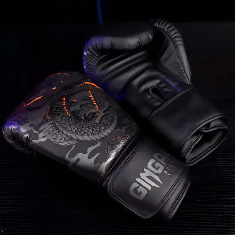 Gants de boxe noirs avec un dragon gris et des accents orange.