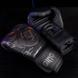 Gants de boxe noirs avec un dragon gris et des accents orange.